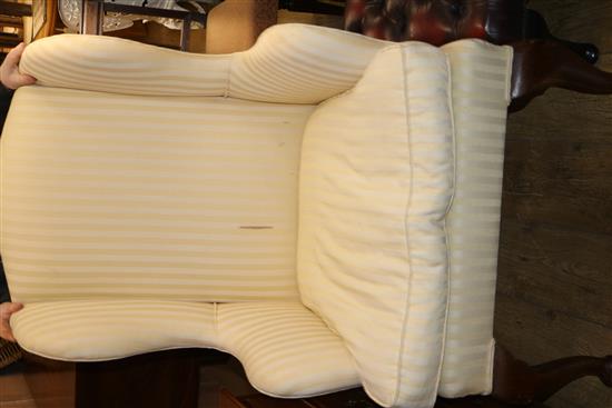 An upholstered wing armchair